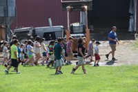 students walking with owner of dutch hill creamery