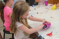 girl working on robot in c v summer steam program