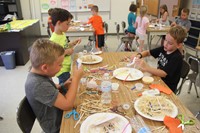 summer steam students working on three little pigs houses