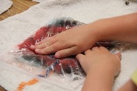 upclose of hands turning wool into felt