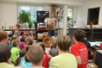 chris mckinney shows students bag of colorful wool