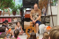 chris mckinney shows summer steam students how wool is spun