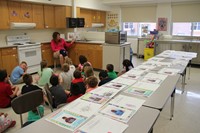 teacher reads to students in c v summer steam