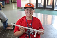 mike turner smiles holding steam project during lunch break at boces steam