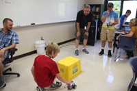 mister cass helps students test robots at boces steam