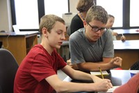 students work together on equation