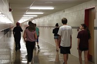 group of students walking down hall at freshman orientation