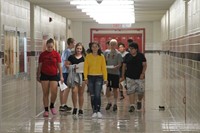 students walking down hallway