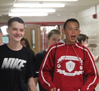 students walking down high school hallways