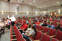 principal attleson speaks with seventh and eighth graders and their parents and guardians about upco