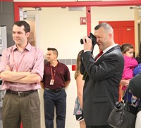 principal attleson takes photos at middle school orientation