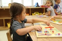 girl works on puzzle