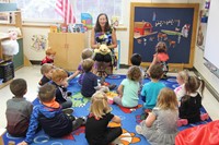 pre k class learns about manners while sitting on rug in classroom on first day