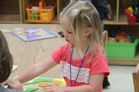 pre k student works on puzzle