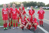 members of j v girls soccer team smiles for a picture after their game