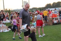 mister tomm hands out donuts