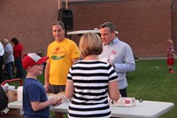 superintendent gill helps serve food to members of the community at rally in the valley event