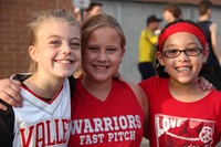 three girls smile for a picture at rally in the valley
