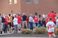 wide shot of people at rally in the valley