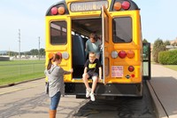 middle school student exits from the back of the bus for bus drill