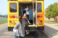 students exit back of bus for bus drill