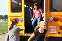 students exit from back of the bus for bus drill