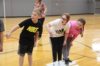 students play a challenge of lava game for team building exercise