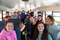 students smile happy to do bus drill