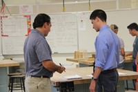 mister carson talks with parent at middle school open house