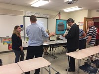 parents talk with teacher at middle school open house