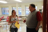 teacher and parent talk at middle school open house