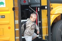 boy getting off bus at chenango bridge elementary