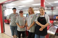 chenango bridge food services staff smiles in front of renovated cafeteria kitchen
