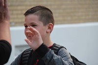 student abot to give a high five on first day of school at chenango bridge elementary