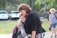 student gives principal mary beth hammond a hug on first day of school