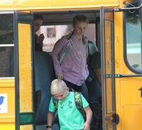 students exiting school bus