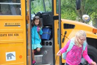 students getting off the bus for the first day of school at chenango bridge elementary