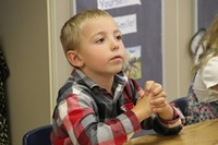 student listening intently at first day of school