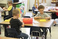 students build with legos on first day