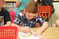 boy colors happy first day of kindergarten picture