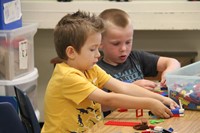 boys create with legos on first day of school