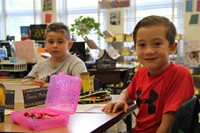 boys smile sitting in classroom on first day of school