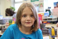 close shot of young elementary student smiling on first day