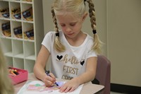 girl colors on first day of school