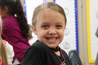 girl smiles wide on first day