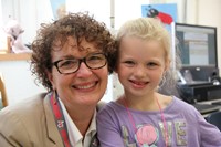 mrs donahue smiles with student on first day of school