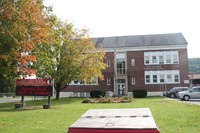 outside of port dickinson elementary building exterior with marquee that reads welcome back students