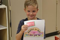 port dickinson elementary student holding first day of kindergarten picture he colored