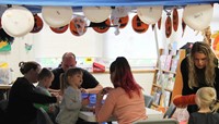 people working on scarecrow hat projects