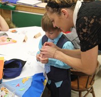 people working on scarecrow hat